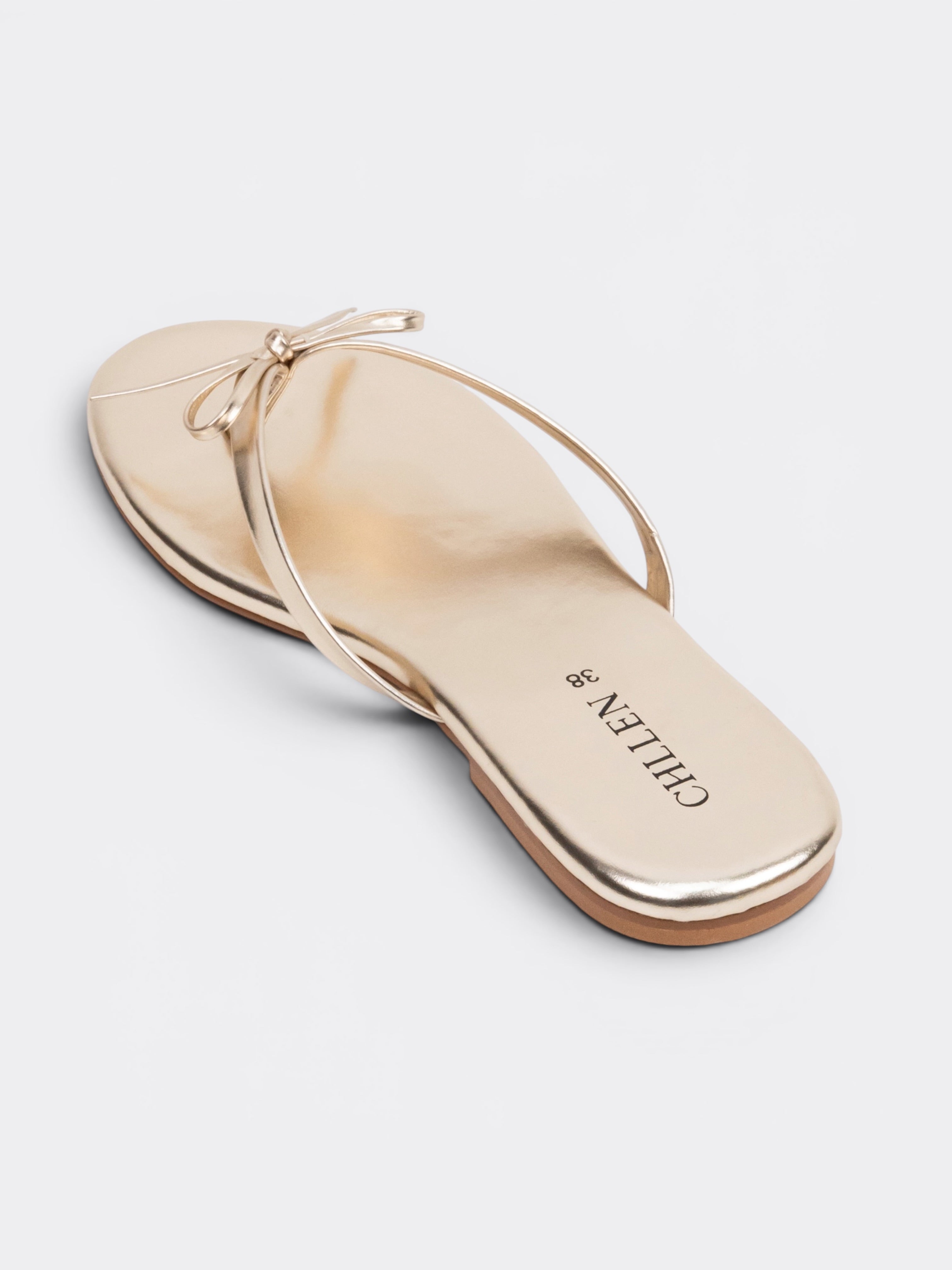 CHLLEN Aurora Bow Metallic Toe Ring Flats – Champagne Gold