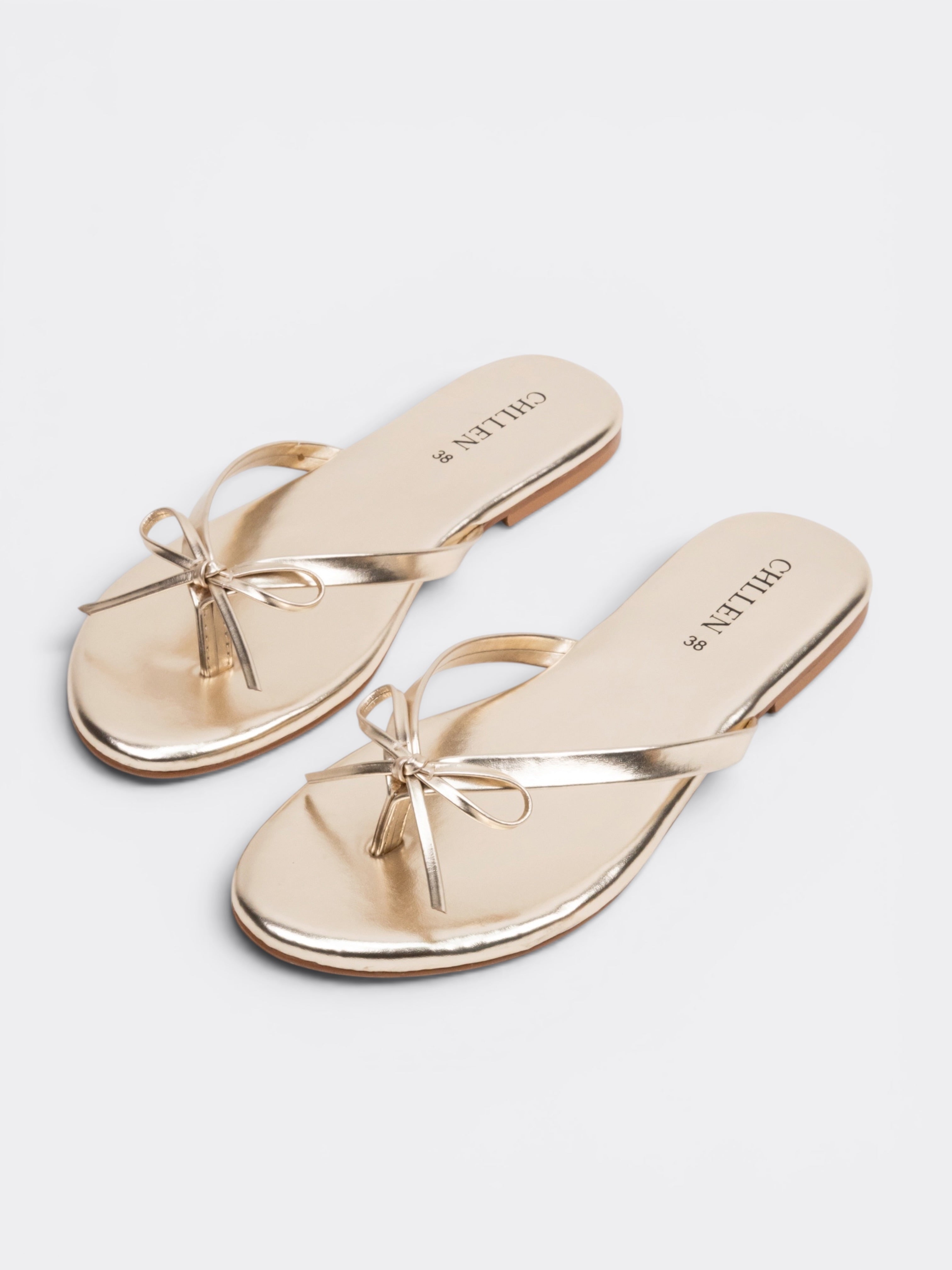 CHLLEN Aurora Bow Metallic Toe Ring Flats – Champagne Gold