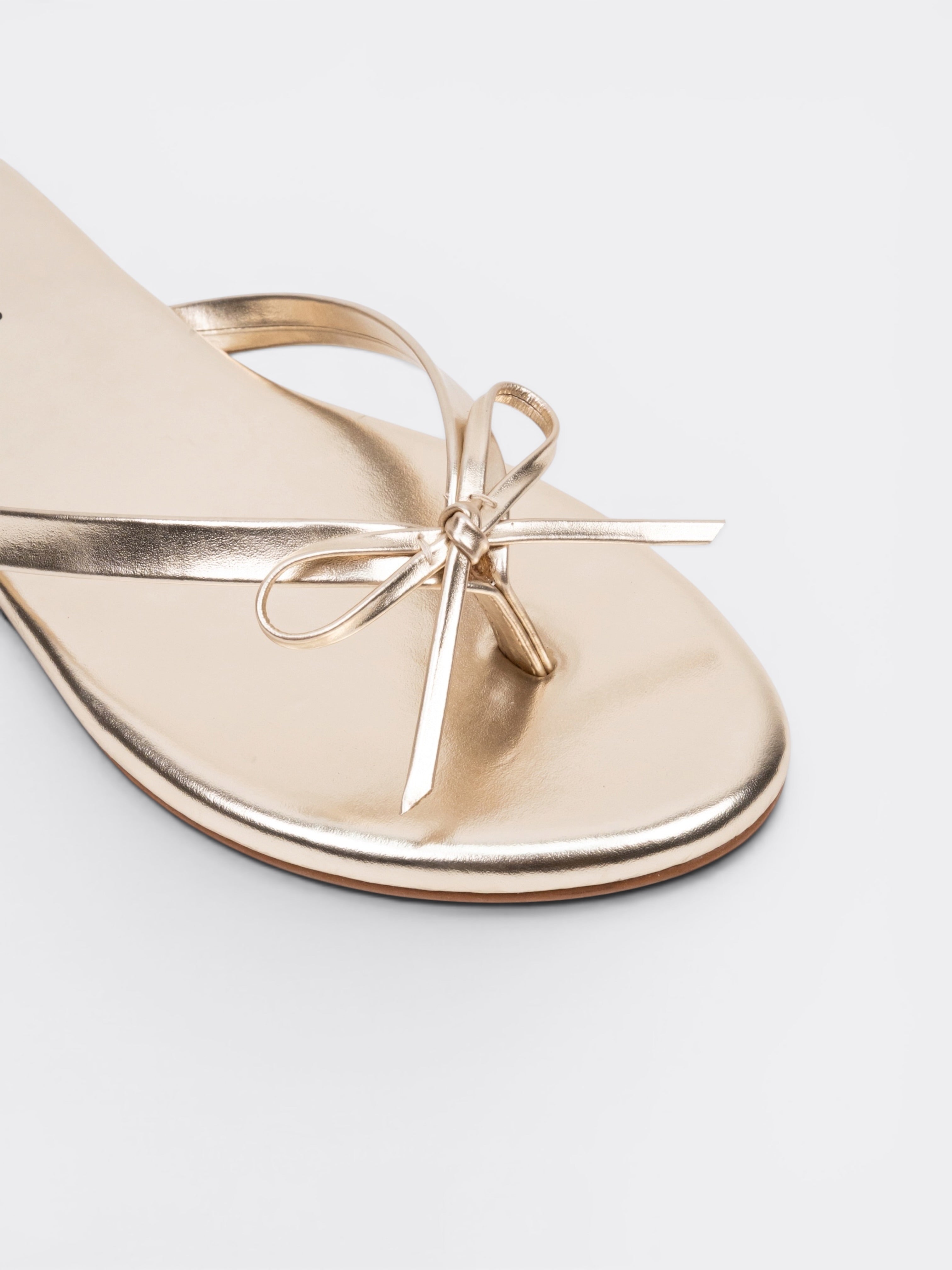 CHLLEN Aurora Bow Metallic Toe Ring Flats – Champagne Gold