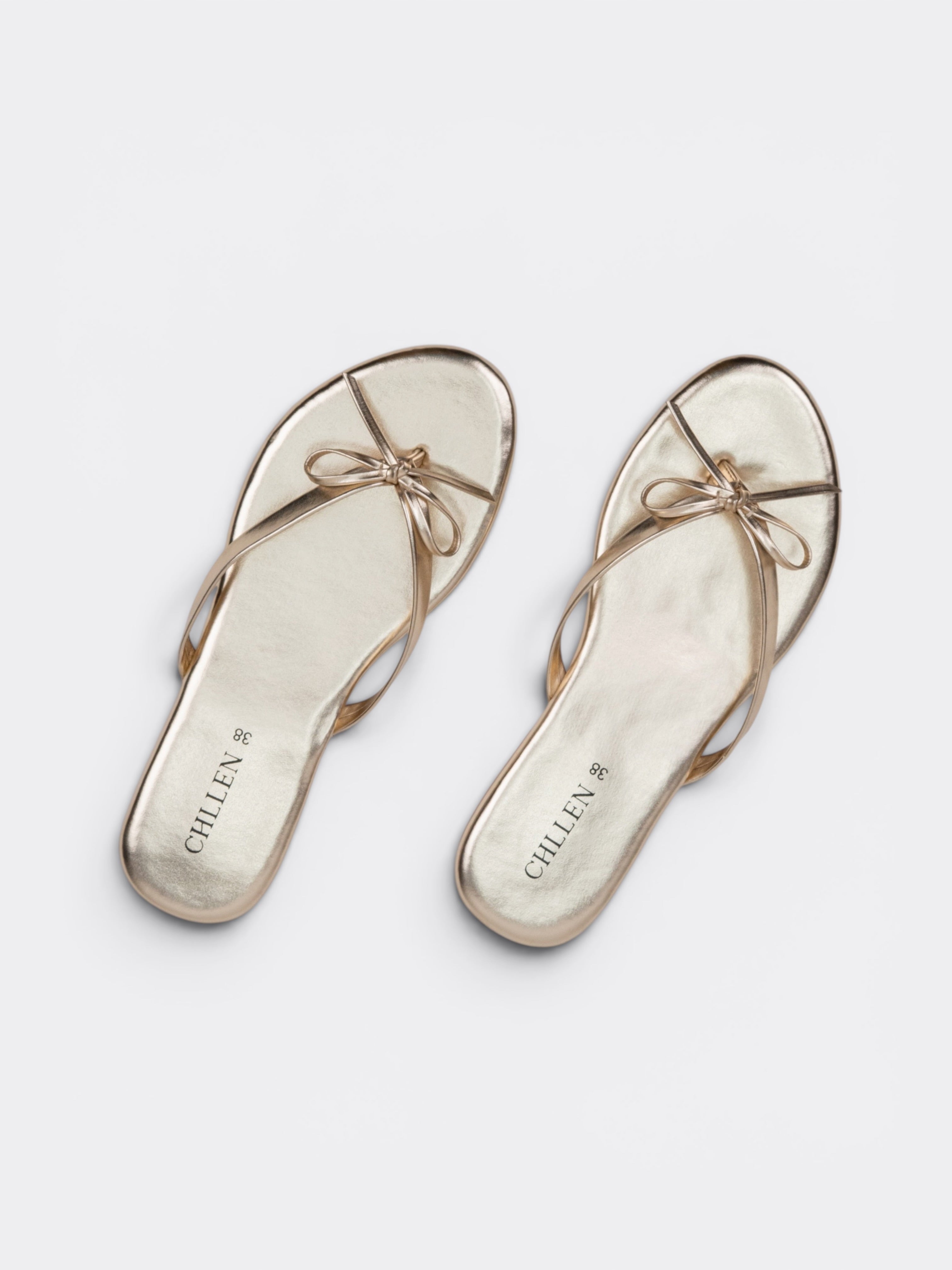 CHLLEN Aurora Bow Metallic Toe Ring Flats – Champagne Gold