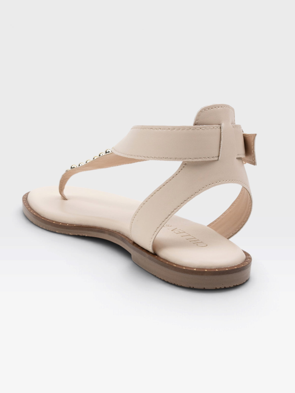 CHLLEN Ivory Flat Sandals with Gold-Tone Stud Accents and Toe-Loop Design